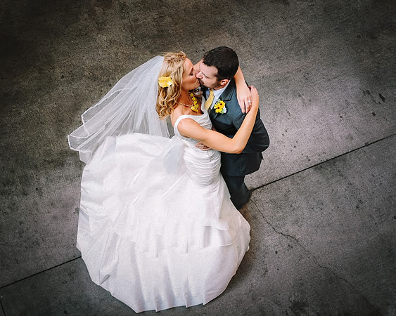Bride and Groom sharing a kiss, an intimate loving moment.